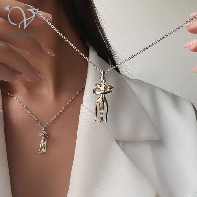 IMG_20240928_181418_255.jpg گردنبند آغوش ( بغل ) استیل دو رنگ طلایی نقره ای کد 7115 - Image 1