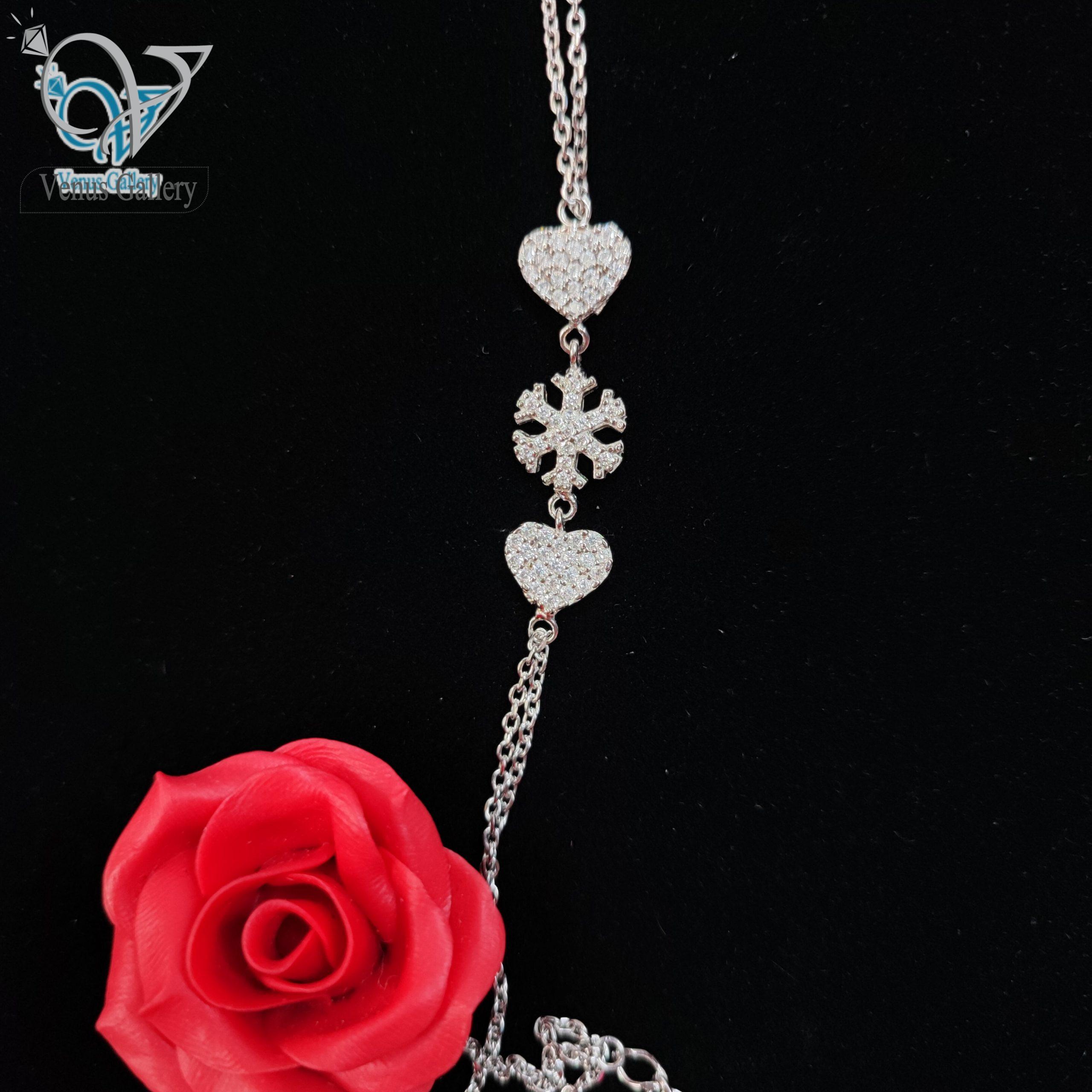 InShot_۲۰۲۴۰۲۲۷_۱۸۰۱۵۸۱۷۶-scaled-1.jpg دستبند نقره دخترانه طرح قلب و دونه برف - Image 1