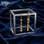 گوشواره آویز نقره طرح گوی تراش‌خورده